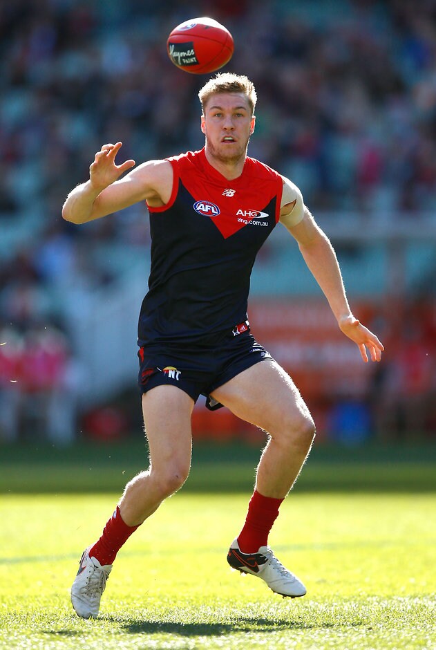 AFL 2016 Rd 19 - Melbourne v Gold Coast MELBOURNE, AUSTRALIA - JULY 31: Tom McDonald of the Demons in action during the 2016 AFL Round 19 match between the Melbourne Demons and the Gold Coast Suns at the Melbourne Cricket Ground on July 31, 2016 in Melbourne, Australia. (Photo by Adam Trafford/AFL Media)
